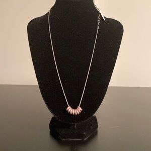 Claire’s necklace pink sparkly pendents on silver colored chain.